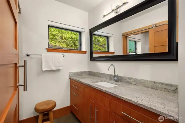 The share bath for the two additional bedrooms and the media room.