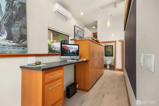 The space behind the kitchen provides plenty of additional storage and a great office space.