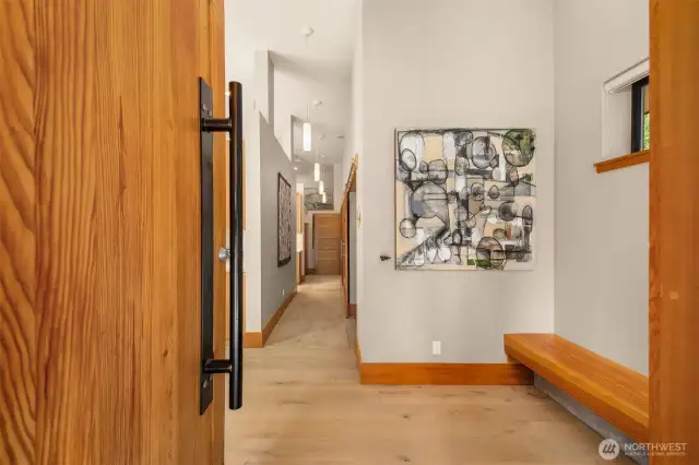 The pivot front door is solid wood and opens to the entry.