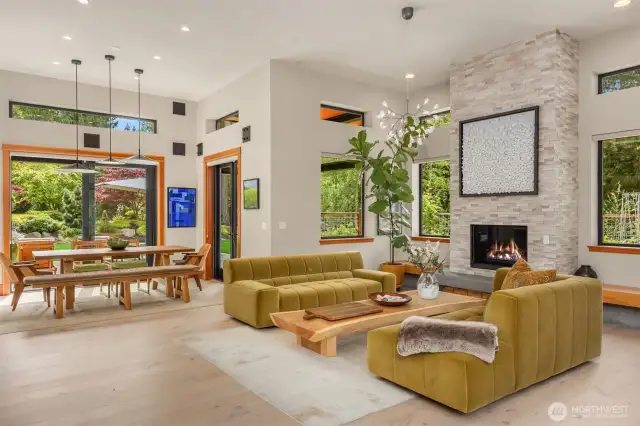 The living room and dining area with doors that open to the front patio and outdoor dining area.