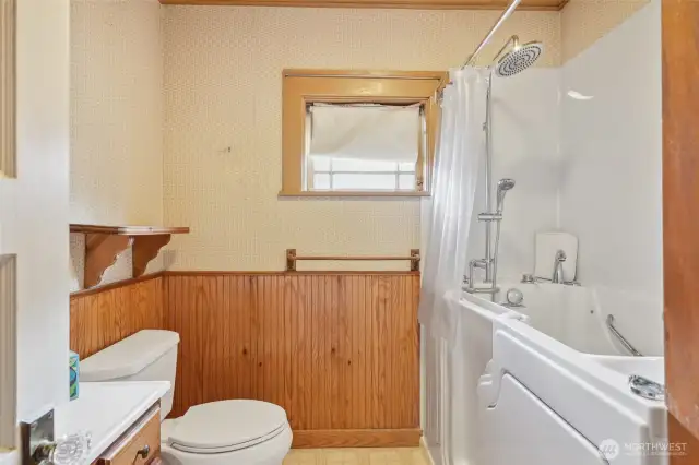 Hall full bath, with walk in tub/shower combo.