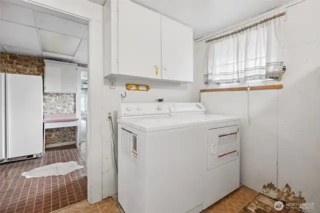 Laundry space off of kitchen