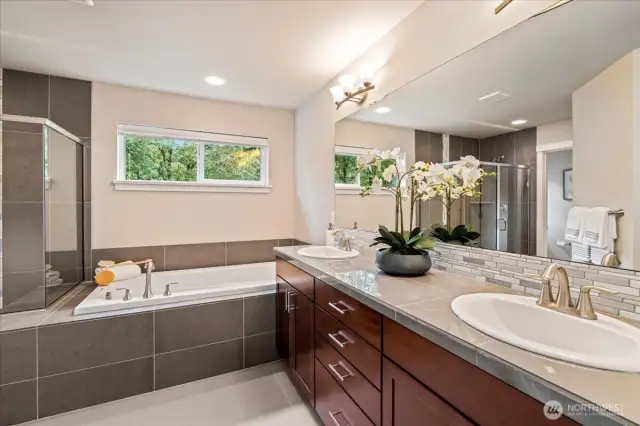Plenty of storage and counter space in the primary bathroom with dual vanities