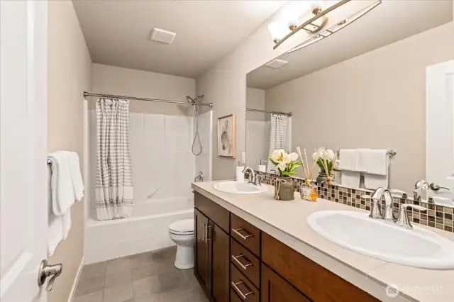 Guest bathroom with dual vanities