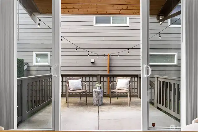 French doors open wide to blend indoor and outdoor living.
