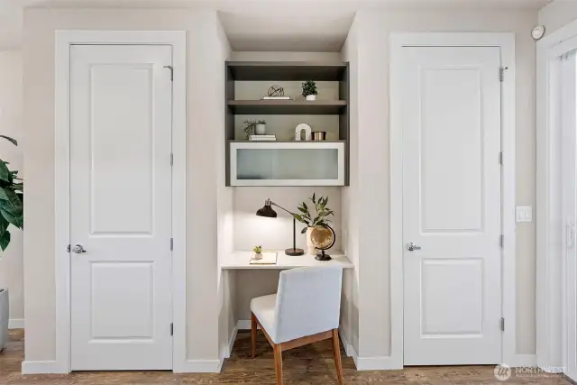 Built-in office nook just off the kitchen, ideal for a home office setup.