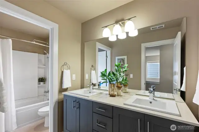 Large hall bath with double vanity.