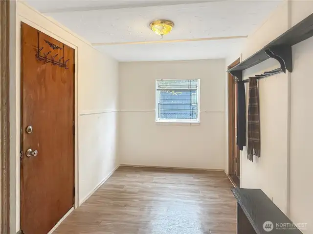 Large mudroom. Maybe add more space to the bathroom and move the laundry here.