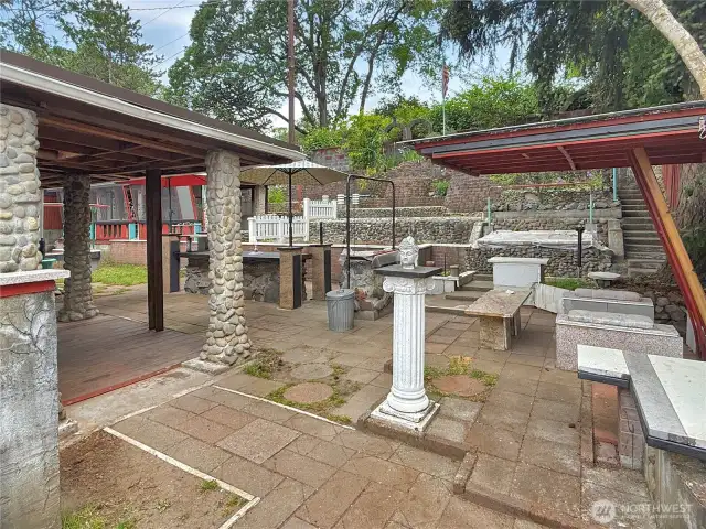 Lots of pavers, covered areas and garden beds.