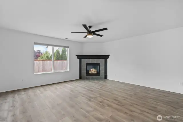 Tile wraps the gas fireplace with wooden mantle, providing winter warmth and bringing ambiance to the room.