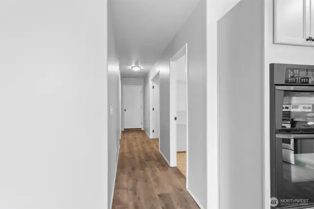 Hallways leads to the pantry, office, and garage.