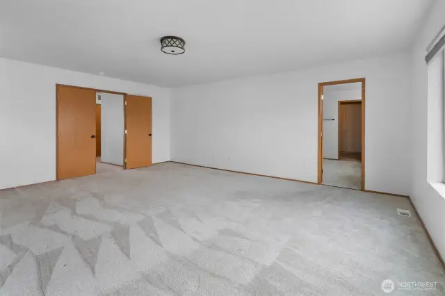 Another view of the Primary suite showing the attached bathroom.