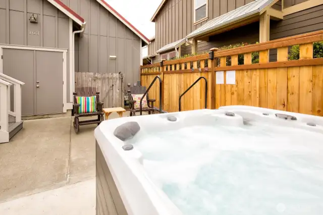 Hot tub and attached storage.