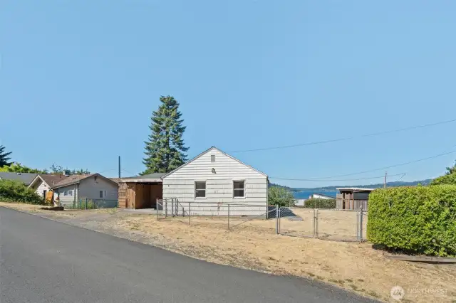 Positioned on a corner lot, this Lakeridge property offers sweeping Lake Washington views and endless potential to design your dream retreat or enhance the home that’s already here.
