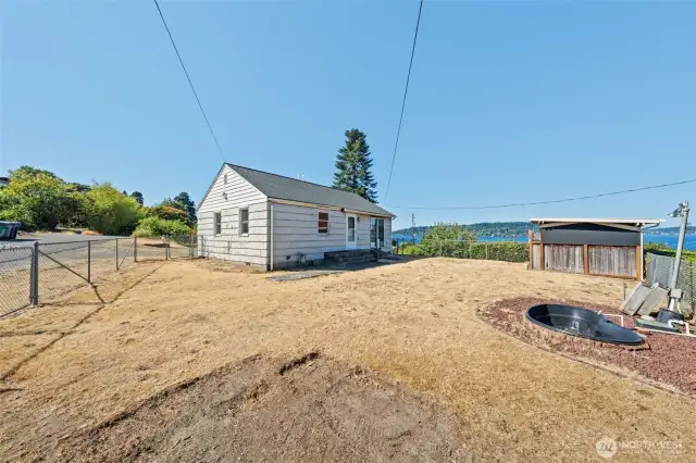 Enjoy a prime corner location with clear sightlines to the lake, surrounded by mature landscaping that offers both charm and privacy.