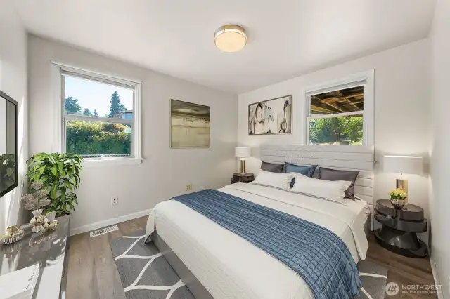 Bedroom Three offers a versatile retreat with generous windows and a flexible layout—ideal for hosting guests, setting up a home office, or creating your own personal sanctuary. (Virtually Staged)
