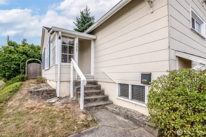 Your guests can enter through the front door, off the front porch, or come straight to the generous backyard through the side gate.