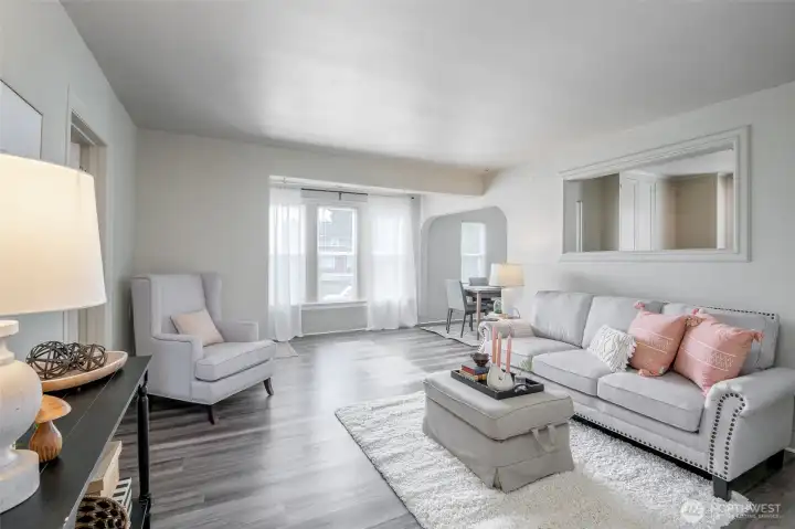 Pretty light streams in through the large windows, making this living room a perfect place for your morning coffee.