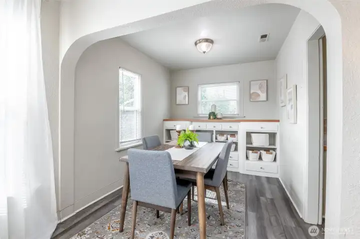 Original features in this home include built-ins, a coved archway, glass door knobs, and vintage charm.