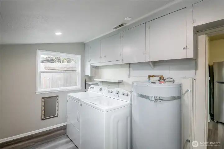 Conveniently located laundry room and mud room just off the kitchen