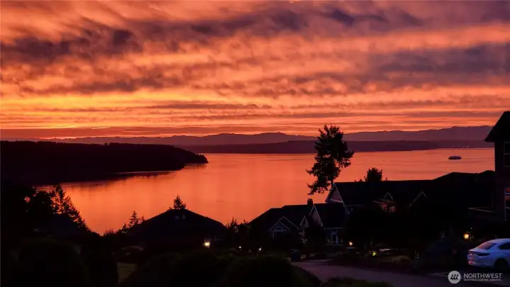 This is a "sunrise home".  The seller caught just one of the many beautiful mornings with this photo.  Not a bad way to start your day.