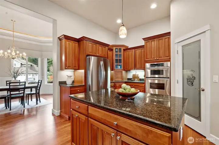 Gorgeous cabinetry, ample storage, and a walk-in pantry.