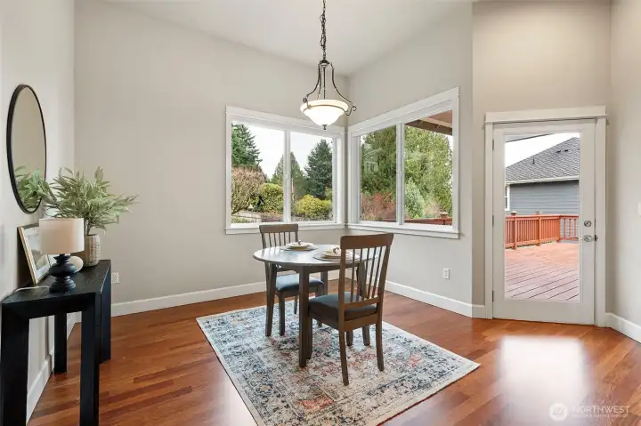 Just off the kitchen is a lovely casual eating area, which leads to the expansive deck.
