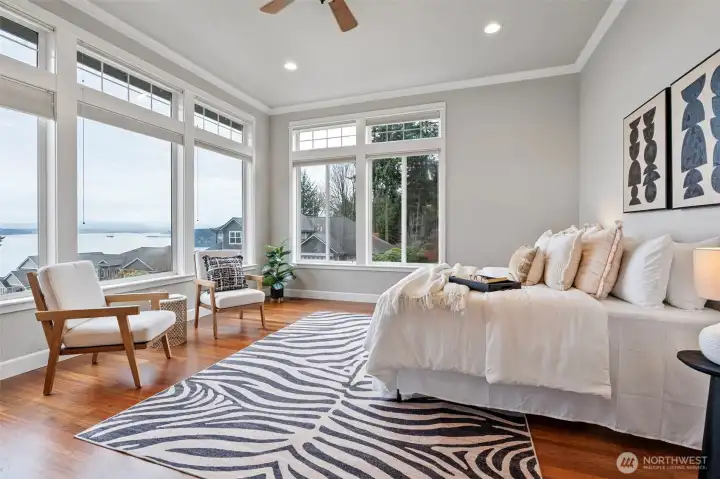 Primary bedroom has an even better view of the Sound and Mt. Rainier. Imagine waking up to this everyday!