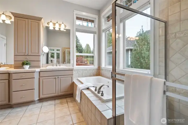 Primary bath features separate sink areas, a large shower, and a great jetted tub. You deserve it!