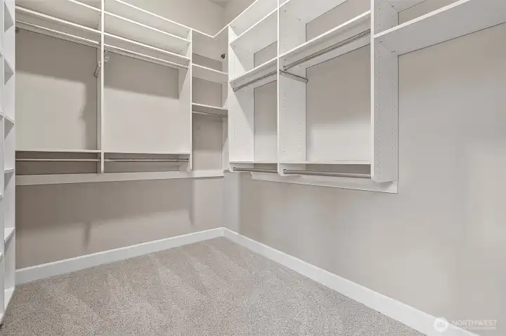 To complete the luxurious primary suite, there is a nicely sized walk-in closet with excellent shelving.