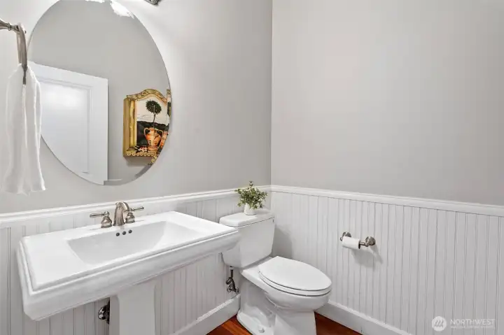 Guests will enjoy the half-bath tucked away from the entertaining spaces.