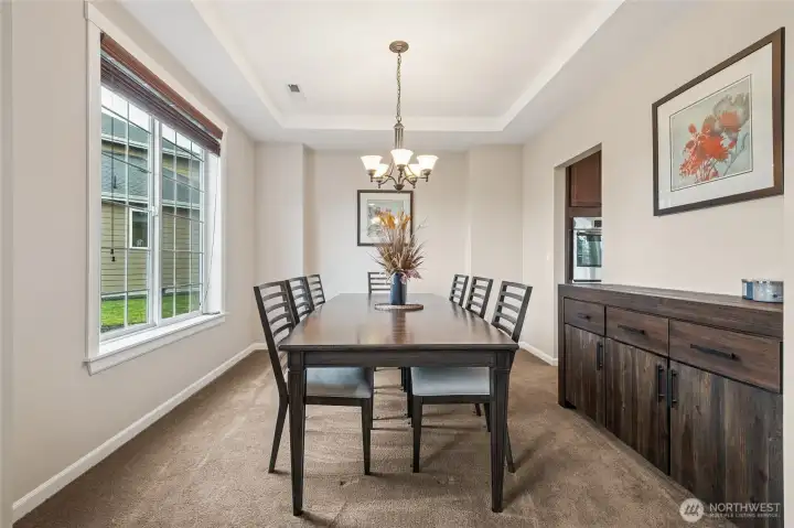 An elegant formal dining room provides the perfect setting for hosting dinners and celebrations. Its classic layout allows for both intimate meals and larger gatherings.