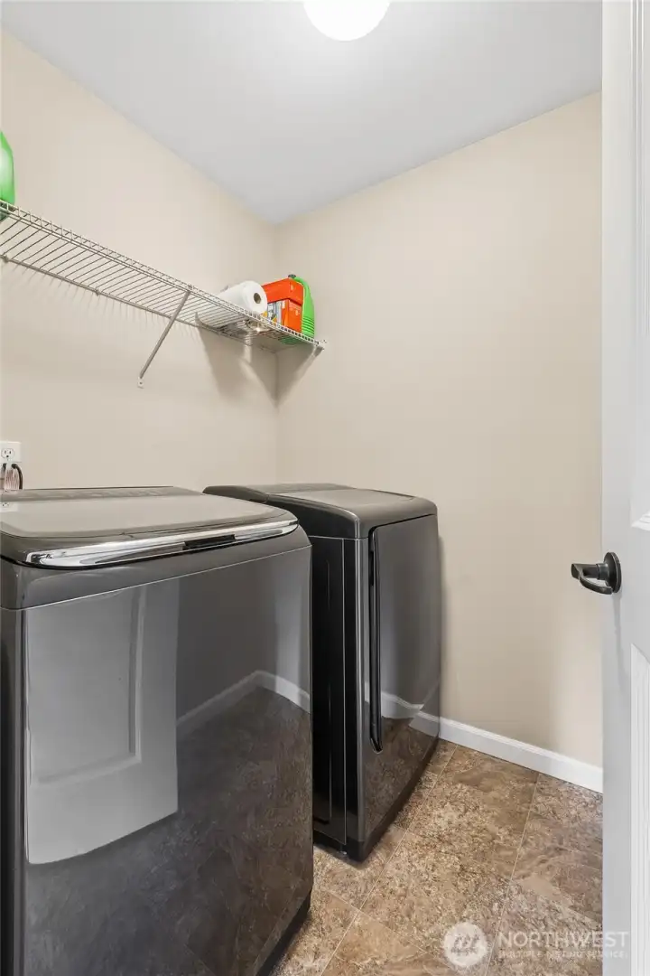 The upstairs utility room adds everyday convenience with the washer and dryer included. Located near the bedrooms, it makes laundry tasks efficient and easy while keeping the space neatly tucked away. Ample room allows for storage and organization, enhancing overall functionality.