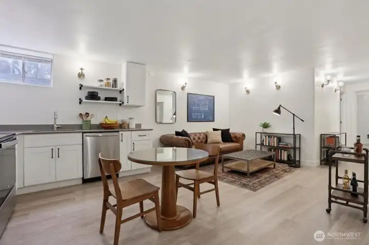 Basement apartment living room and kitchen. Virtually staged