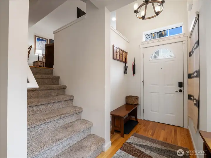 The entry way has room to sit down and tie your shoes.