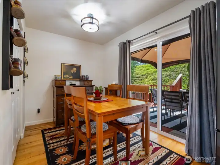 The more formal eating area has a great view of the back deck.