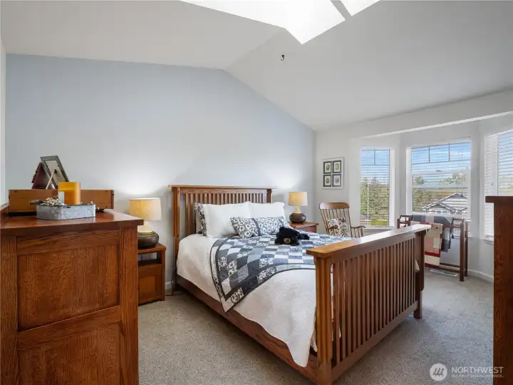 Bedroom 1 has a soft color pallet for a serene feel.