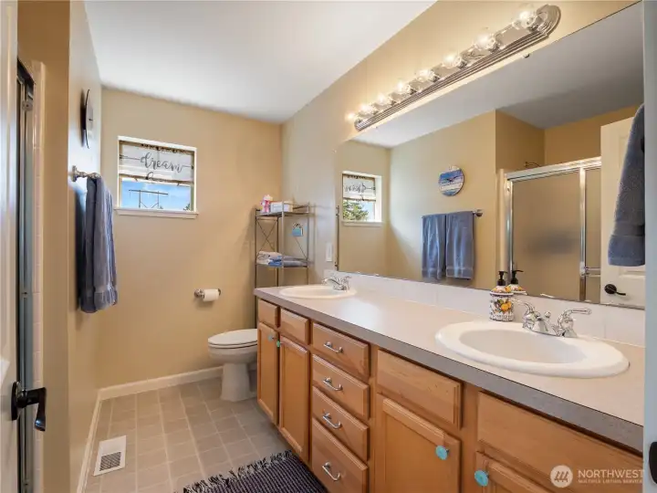Double sinks in the primary bathroom makes getting ready in the morning easy.