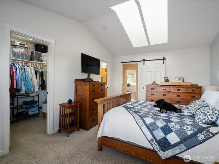 The large walk-in closet holds your wardrobe and more.