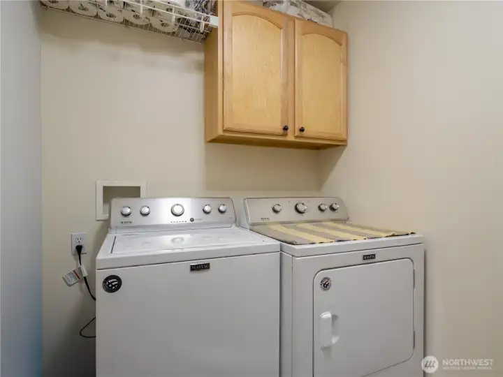 The laundry room offers a full size washer and dryer.