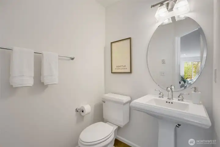 Powder room off the Kitchen + Living Room