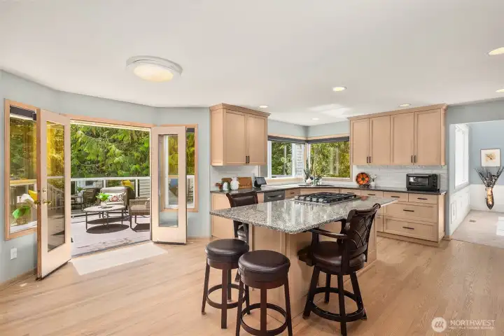Breakfast bar area with french doors to the back deck~
