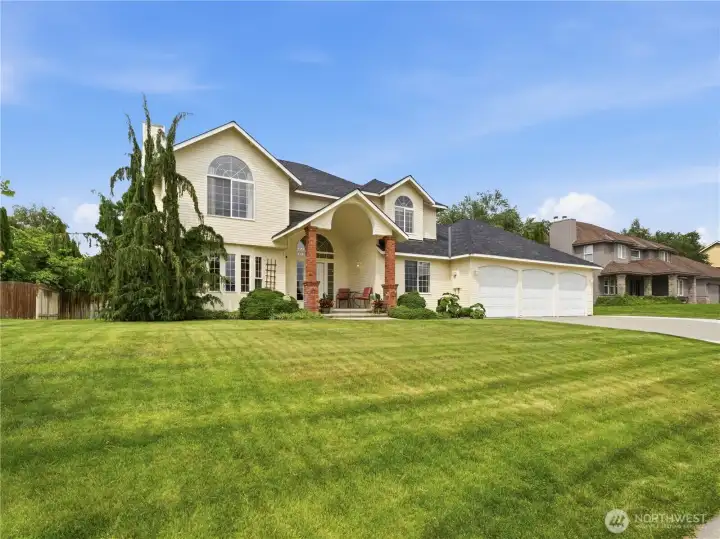 Welcoming front exterior showcasing pride of ownership and desirable neighborhood setting.