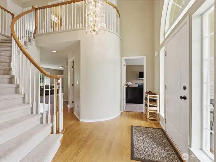 Bright foyer creating a warm first impression with convenient access to main living spaces.