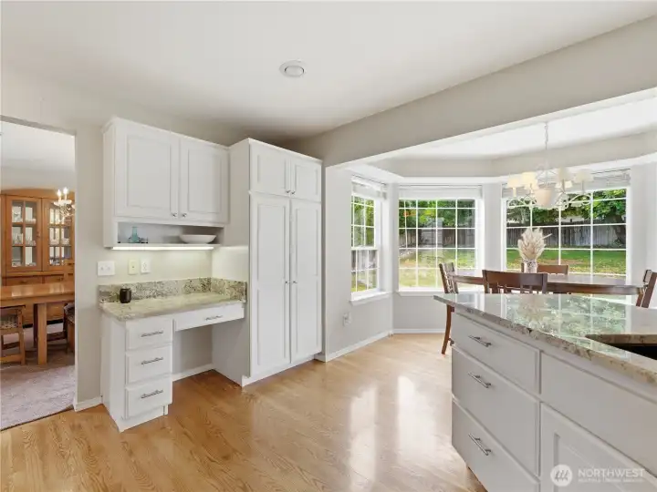 Kitchen and dining nook creating the perfect space for casual meals and morning coffee.