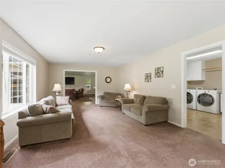 Spacious family room located just off the kitchen, creating the perfect layout for everyday living and entertaining.