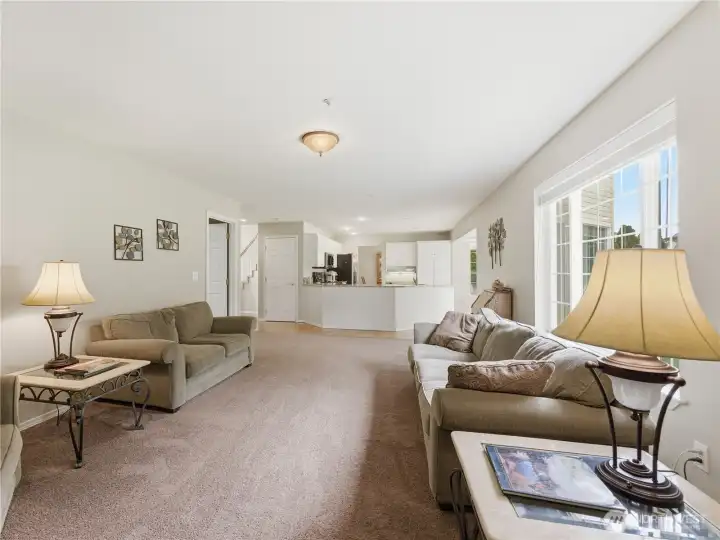 Spacious family room located just off the kitchen, creating the perfect layout for everyday living and entertaining.