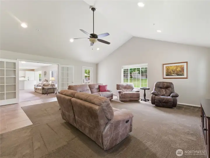 Spacious bonus room featuring a convenient wet bar, perfect for entertaining guests, game nights, or creating the ultimate media room.