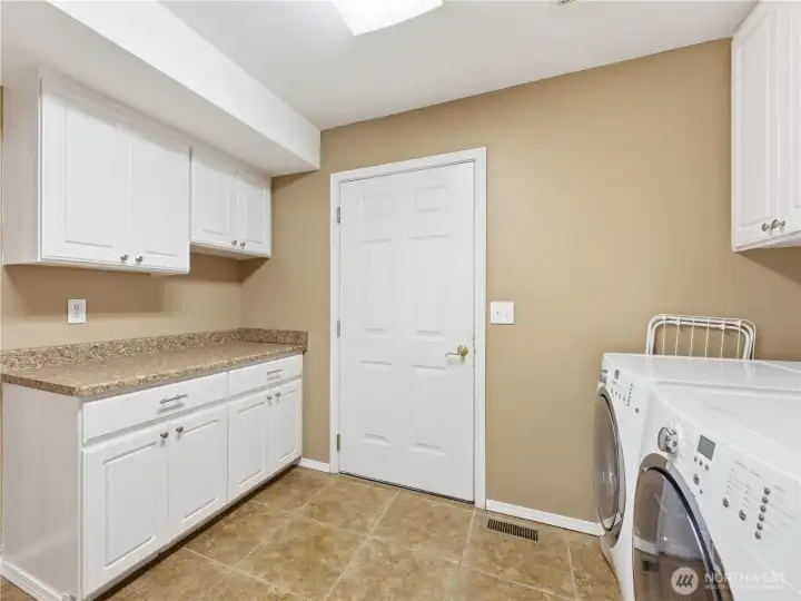 Functional laundry and storage area designed to keep household essentials organized.