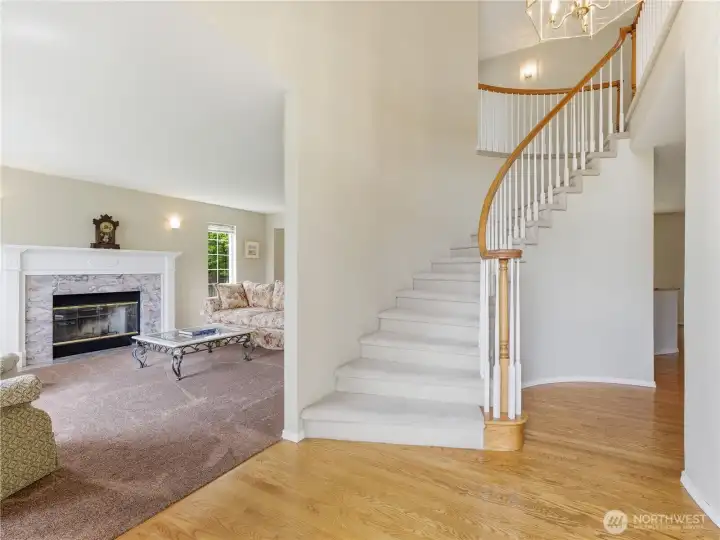 Bright foyer creating a warm first impression with convenient access to main living spaces.